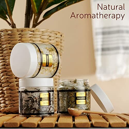 Three jars of aromatherapy bath salts with a natural background.