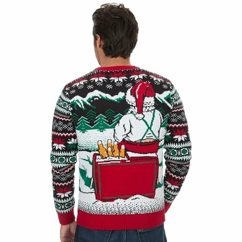 Person wearing a festive holiday sweater with mountain and cooler design.