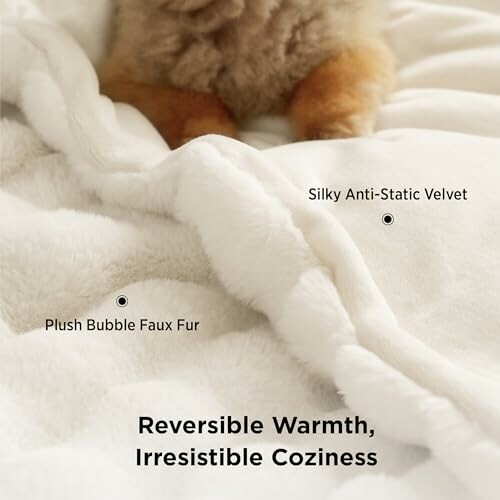 Close-up of a reversible blanket with plush bubble faux fur and silky anti-static velvet.